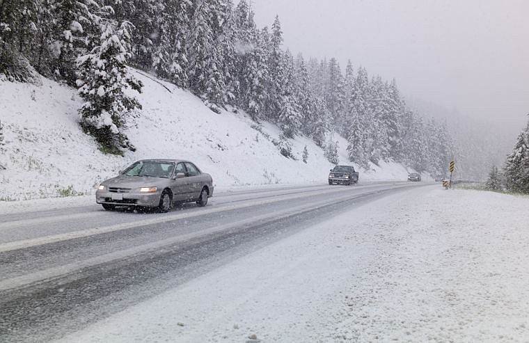 &lt;p&gt;Vehicles head down snowy Marias Pass near Skyland Road on U.S. 2 on Tuesday. The National Weather Service is predicting 15 to 20 inches of snow above 7,000 feet and possible flooding in the valleys. (Chris Peterson/Hungry Horse News.&lt;/p&gt;