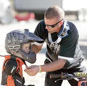 &lt;p&gt;Jesse Erickson, right, adjusting Jayten Erickson's (5) helmet prior his race Saturday. (father and son from Kalispell)&lt;/p&gt;