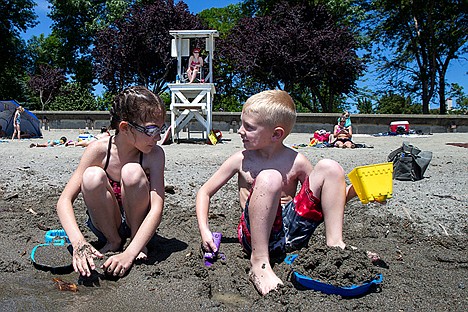 &lt;p&gt;Lifeguard Veronica Buck guards the East side of City Park beach while Kimberly Felts, 8,&#160;and Conner Bellus, 6, play on the beach. Lifeguards will be on duty everyday from 12 p.m. to 6 p.m. until mid-August.&lt;/p&gt;