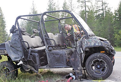 &lt;p&gt;MHP 255 Anthony Jensen studies the crash of a Polaris Ranger belonging to Walter and Darlene Wuest at the 5.4 mile marker of Pipe Creek Road Wednesday evening June 22. (vehicle was righted after found resting on its passenger side pinning occupant)&lt;/p&gt;