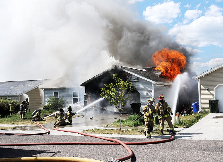 &lt;p&gt;&lt;strong&gt;Firefighters&lt;/strong&gt; extinguish the house fire in the Empire Estates on Thursday. (Aaric Bryan/Daily Inter Lake)&lt;/p&gt;