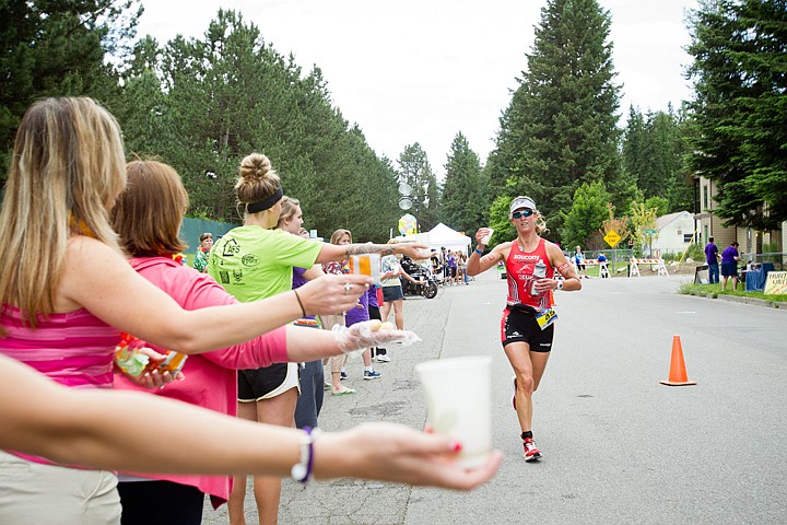 &lt;p&gt;GABE GREEN/Press Marredith Kessler, first place in the women's division, grabs some water from volunteers during the marathon portion of the 2012 Ironman Triathlon in Coeur d'Alene, Idaho.&lt;/p&gt;