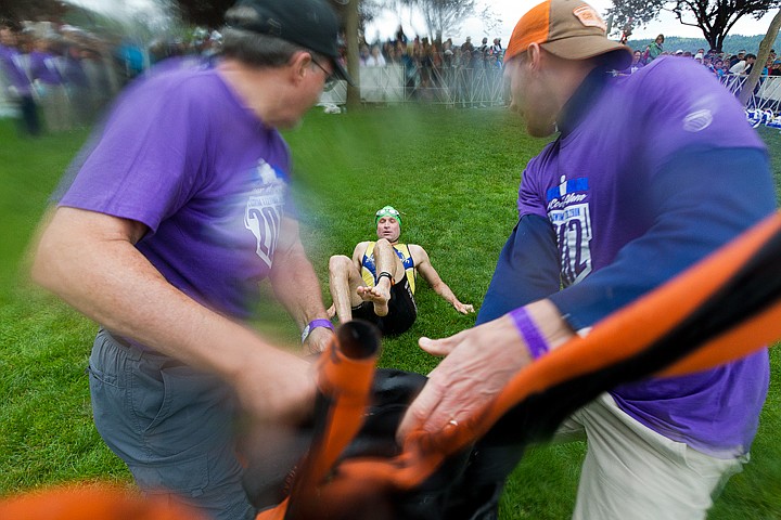 &lt;p&gt;SHAWN GUST/Press Volunteers pull the wet suit off of Tom Evans, of Pentiction, British Columbia, before Evans moved on to the 112-mile bicycle leg of the 2012 Ironman Coeur d'Alene.&lt;/p&gt;