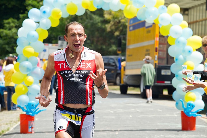 &lt;p&gt;GABE GREEN/Press Leader of the men's division, Viktor Zyemtsev, rallies the crowds along Lakefront Boulevard during the 2012 Ironman Triathlon in Coeur d'Alene, Idaho.&lt;/p&gt;