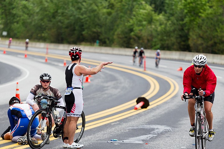 &lt;p&gt;SHAWN GUST/Press Mary Perkins, of Naperville, Illinois, cycles past other athletes who aid a racer who crashed his bike on U.S. 95.&lt;/p&gt;