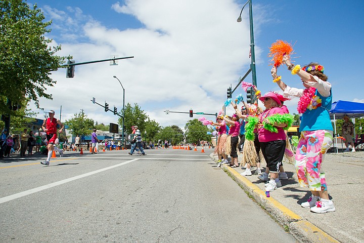 &lt;p&gt;GABE GREEN/Press A group of colorfully clad ladies cheers on runners outside the Flamingo hotel in Coeur d'Alene, Idaho during Ironman 2012.&lt;/p&gt;