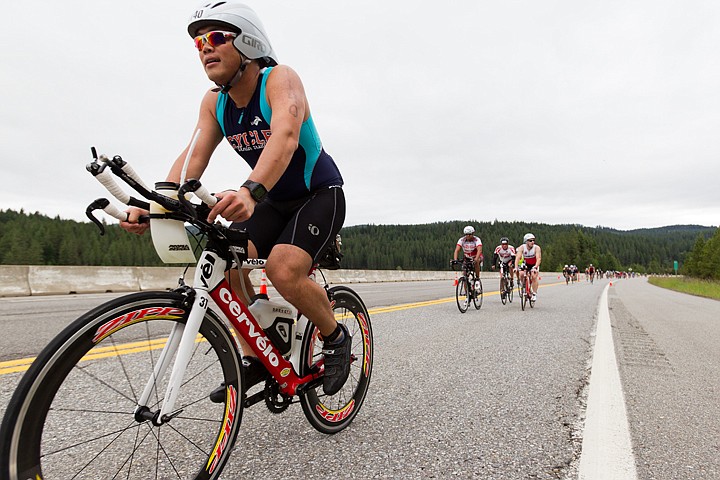 &lt;p&gt;SHAWN GUST/Press Bruce Lam, of Seattle, Washington, climbs a hill on U.S. 95 during his first lap of two of the 112-mile bike race as part of Ironman Coeur d'Alene.&lt;/p&gt;