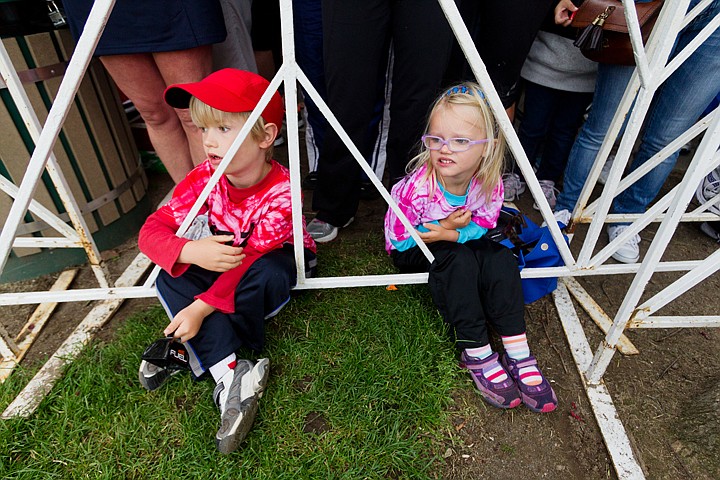 &lt;p&gt;SHAWN GUST/Press Kai Manzo, 6, and his sister T&eacute;a, 4, of San Francisco, wait near a transition station for their father to pass during the 2012 Ironman Coeur d'Alene.&lt;/p&gt;