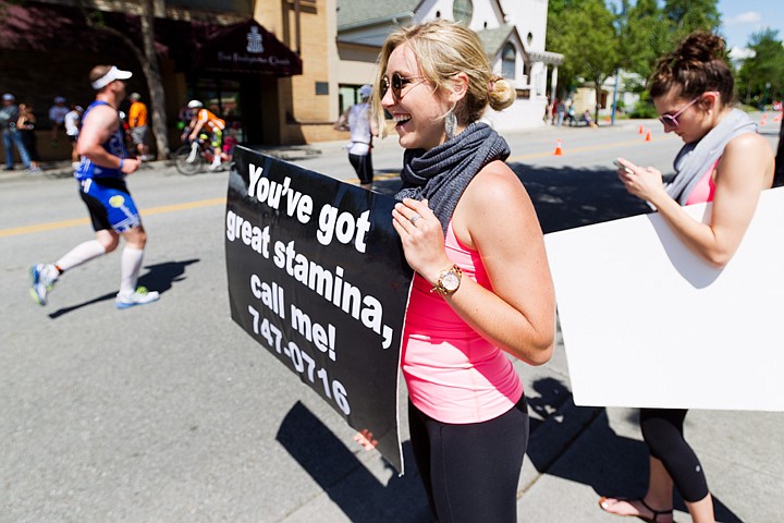 &lt;p&gt;SHAWN GUST/Press Hanna Lorenz, of Spokane, cheers on athletes Sunday with a sign during the Ironman event in Coeur d'Alene.&lt;/p&gt;