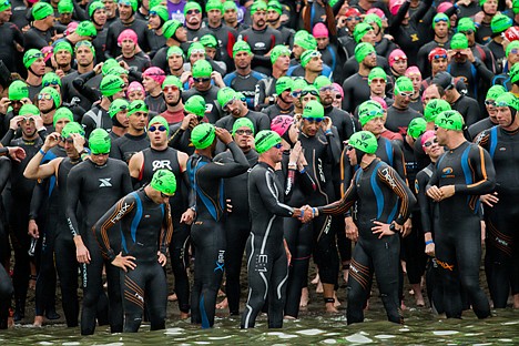 &lt;p&gt;Two Ironman competitors shake hands before the start of the 2012 race Sunday morning in Coeur d'Alene, Idaho.&lt;/p&gt;