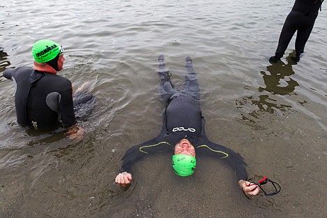 &lt;p&gt;Michael Pickering, of Drewsville, New Hampshire, lies on his back in the shallow waters of Lake Coeur d'Alene prior to the start of the 2012 Ironman.&lt;/p&gt;