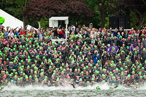 &lt;p&gt;Triathletes rush from the starting line into the waters of Lake Coeur d'Alene during Ironman 2012 Sunday morning.&lt;/p&gt;