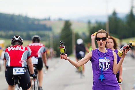 &lt;p&gt;Jenn Peters, of Post Falls, volunteers at a bike aid station during Sunday's Ironman Coeur d'Alene.&lt;/p&gt;