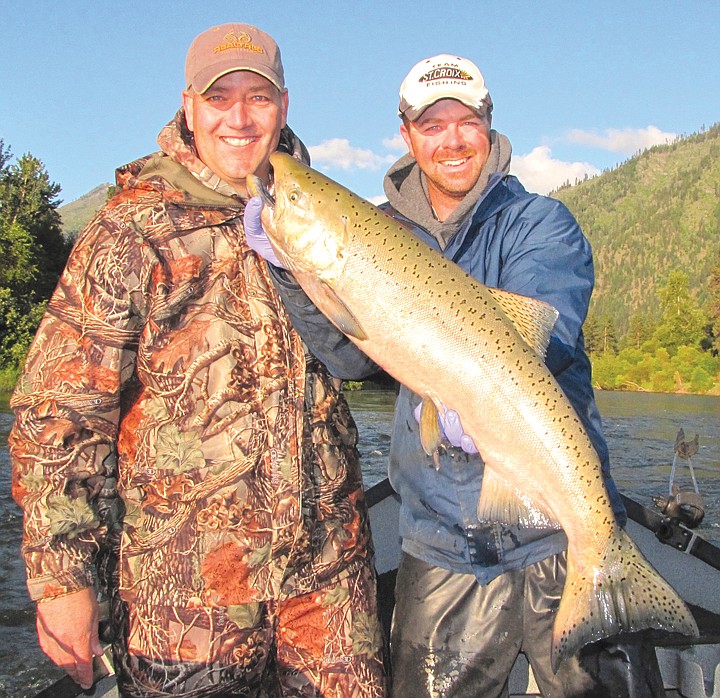 Brett Telford (left) and Shane Magnuson, Upper Columbia Guide
Service, pose with a dandy spring salmon taken on the Icicle
River.