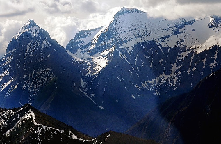 Joined by Kinnerly Peak is Kiltna Peak (to right). Kintla Peak is the highest peak in the North Fork, standing at over 10,000 feet. The snow to the far right of the frame is the Kintla Glacier, one the park&#146;s few remaining glaciers.