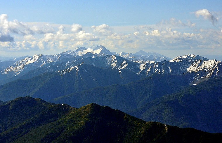 Various mountain peaks sit up high in Glacier Park.