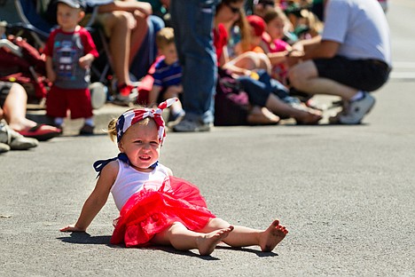 &lt;p&gt;Harley Bolstad, 2, of Post Falls, makes herself comfortable on the hot pavement prior to last year's Fourth of July parade on Sherman Avenue in Coeur d'Alene.&lt;/p&gt;