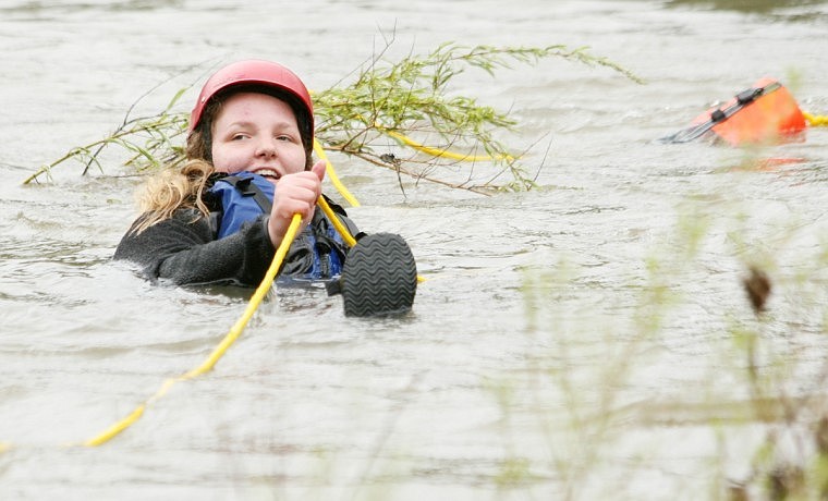 Krista Hoskins from Puyallup, Wash. holds onto the rope line as it lays properly over her shoulder. It's important to throw the bag over the head of the victim so they can grab the rope instead of the bag.