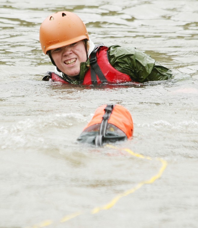 Jake Tyree from Medical Lake, Wash. tries to swim towards the rope and bag during a river rescue training session on Monday.