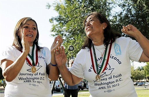 &lt;p&gt;Rosa Maria Soto, right, and Maria Durand, both from Arizona, cheer as they react to the United States Supreme Court decision regarding Arizona's controversial immigration law, SB1070, comes down at the Arizona Capitol Monday, June 25, 2012, in Phoenix. The Supreme Court struck down key provisions of Arizona&#146;s crackdown on immigrants Monday but said a much-debated portion on checking suspects&#146; status could go forward. (AP Photo/Ross D. Franklin)&lt;/p&gt;