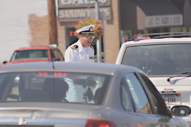 &lt;p&gt;(Retired) Rev. Lt. Cmdr. Timothy Gordish smiles while talking to a driver who donated to the annual Polson fireworks display Saturday near Highway 93 and Second Avenue East&lt;/p&gt;