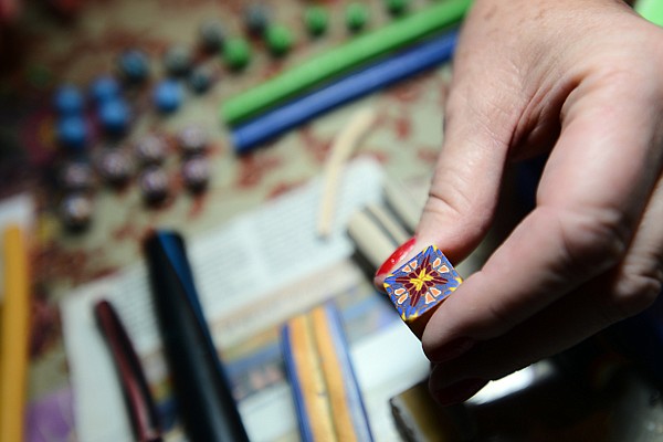 &lt;p&gt;Carolyn Snyder demonstrates how she makes her beads on Thursday, June 20, at her home in Kalispell. (Brenda Ahearn/Daily Inter Lake)&lt;/p&gt;