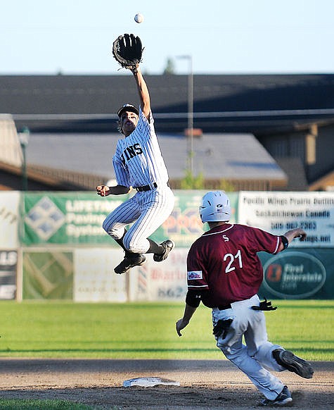 &lt;p&gt;Glacier Twins B shortstop Ryan Veneman leaps for the ball as Glacier Twins A Derek Kastella steals second base during a game at the 26th Ed Gallo Memorial Wood Bat Tournament on Friday, June 26, 2015. (Aaric Bryan/Daily Inter Lake)&lt;/p&gt;