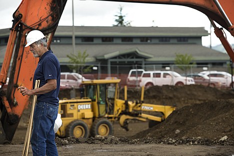 &lt;p&gt;Jim Small, owner of Small's Construction, talks with designers at the cite of the new tennis facility being built for Peak Health and Wellness Center in Hayden Tuesday afternoon. Peak Health and Wellness Center is having a 45,000 square foot health facility constructed in Hayden, costing $5 million for the purchase of the property and construction. They hope to complete the project by next year.&lt;/p&gt;