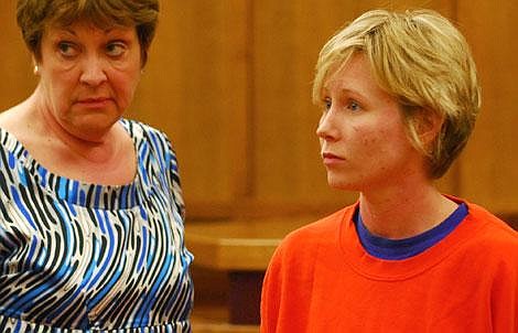 Steffanie Ann Schauf looks at her family and friends after being released on bond Wednesday in Flathead County District Court. Flathead Detention Commander Kathy Frame is at left. Garrett Cheen/Daily Inter Lake