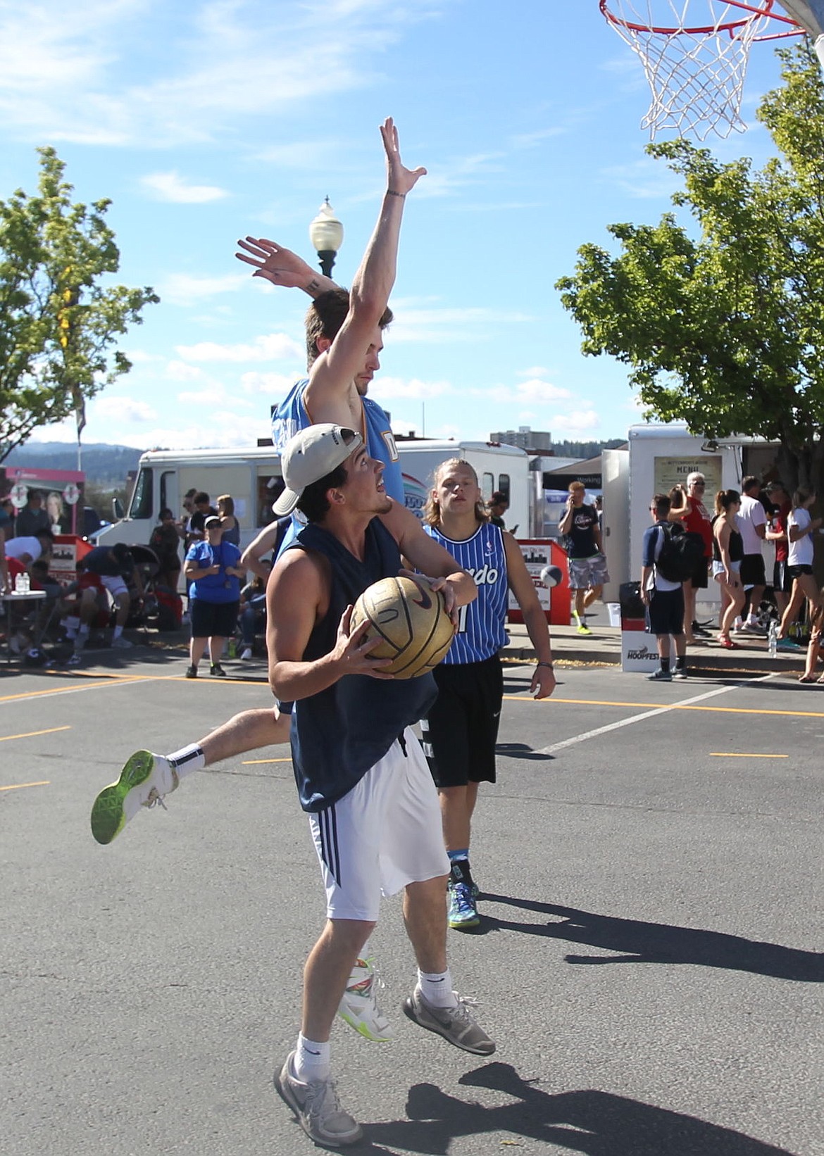 <p>JASON ELLIOTT/Press</p><p>Former Post Falls standout Dalton Thompson jumps to block a shot of a Jazz Boys player during an opening round game at Hoopfest in the Spokane Arena parking lot on Saturday. Title Town went 2-0 to advance to the championship bracket today starting at 9 a.m.</p>