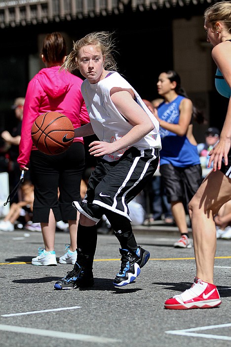 <p>Courtney Jennings of Kirb, a Wallace-based team, waits for a screen during the team's opening game on Saturday at Hoopfest. Jennings, along with Emily Nelson, Tony Branz and Jon Dellinger, were eliminated after posting a 2-2 record.</p>