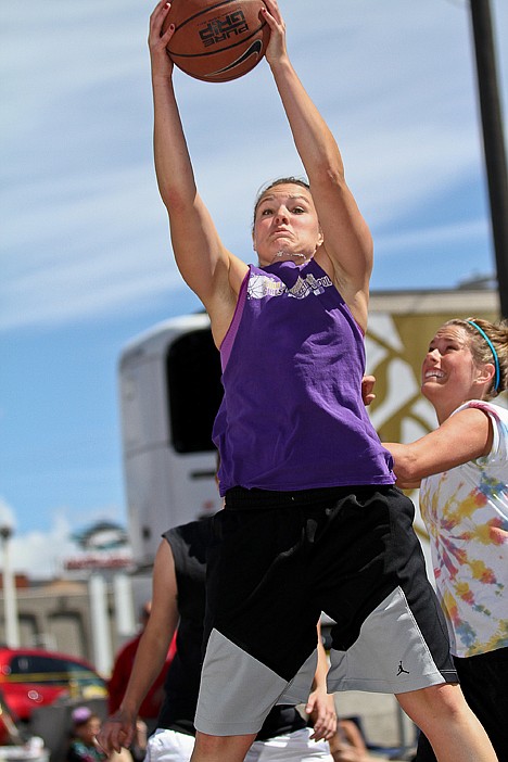 <p>Cassie Scheffemaier of Thuper Dooper pulls down a rebound during an early Saturday game at Hoopfest. Scheffelmaier played at Kootenai High, Unpqua Community College and Carroll College.</p>