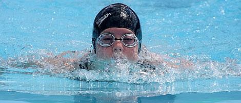 Photo by Aaric Bryan Plains Piranha Vanessa Kinzie prepares to go back under the water in the girls 11-12 50-meter breaststroke Sunday in Plains. Kinzie finished in seventh place in the race.