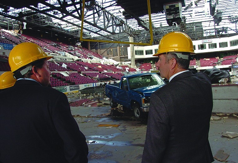 Billings Mayor Tom Hanel, left, shows Montana Gov. Brian Schweitzer the damage caused by a tornado that hit the city's Rimrock Auto Arena, Monday in Billings, Mont. Schweitzer on Monday declared a state of emergency for the area hit by the tornado on Sunday.