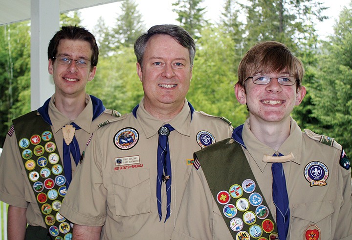 Todd Malone, center, stands with sons Sean, 17, left, and Danny, 14. A former Eagle Scout himself, Malone leads his sons&#146; Boy Scout troop, serving as a father figure not only to his own two sons, but also to other area teens involved in the troop.