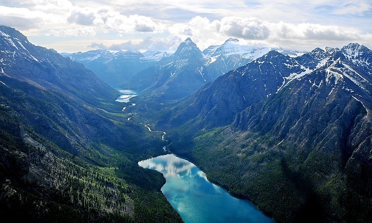 Kintla Lake, the northeasternmost lake in Glacier National Park, mirrors clouds over the mountain peaks in this aerial view taken Friday morning. Upper Kintla Lake is to the left of Kintla Lake.