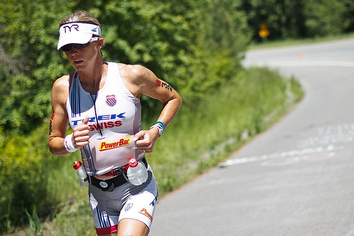 &lt;p&gt;SHAWN GUST/Press Julie Dibens, who set a course record with a time of 9:16:40, races up the Bennett Bay hill in Sunday's Ironman Coeur d'Alene, her second. Dibens was the top-finishing female.&lt;/p&gt;