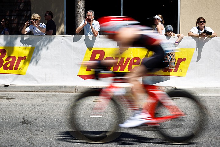 &lt;p&gt;SHAWN GUST/Press Paul Lamphier shouts in support as his son Tom zooms passed in the 2011 Ford Ironman Coeur d'Alene.&lt;/p&gt;