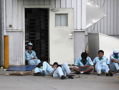 &lt;p&gt;In this photo taken Tuesday, June 22, 2010, workers rest during a strike at the Denso Corp., a Japanese car parts supplier to Toyota Motor Corp., in Guangzhou in south China's Guangdong province. Toyota said production at the one of its main factories in China remained halted Wednesday because of a strike at the supplier, the latest Chinese labor action to hit the Japanese carmaker in recent weeks.&lt;/p&gt;