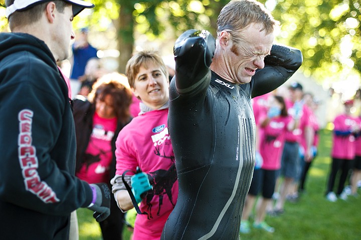 &lt;p&gt;SHAWN GUST/Press Brian Hadley, of Coeur d'Alene, grimaces as he tries to unzip his wetsuit in the transition area Sunday prior to the cycling leg of the 2011 Ford Ironman Coeur d'Alene.&lt;/p&gt;