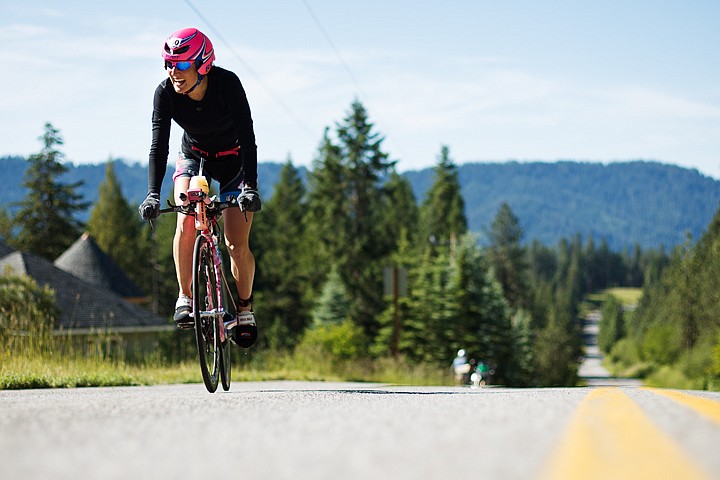 &lt;p&gt;SHAWN GUST/Press Caitlin Snow climbs a hill on Hayden Lake Road during her first lap of the cycling leg of Ironman. Snow finished second in her division with a time of 9:29:18.&lt;/p&gt;