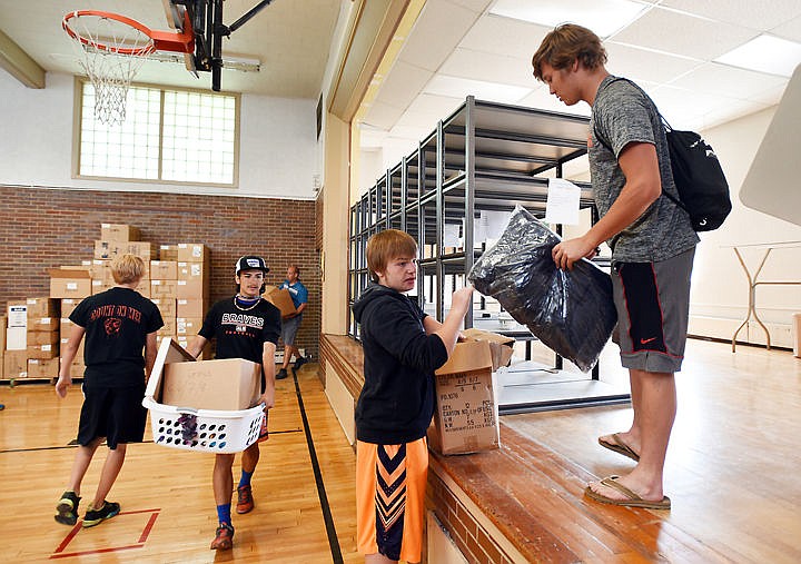 &lt;p&gt;&lt;strong&gt;From right&lt;/strong&gt;, Hunter Wellcome, Maveric Clarke, and Eric Reyna and other members of the Flathead football team unload boxes into the new home of the Heart Locker, on Monday, June 22, in Kalispell. The Heart Locker is a free &quot;store&quot; for students filled with new and lightly used items. The Heart Locker has outgrown it's first location on Meridian and has taken over the old Edgerton School on E. Washington Street. (Brenda Ahearn/Daily Inter Lake)&lt;/p&gt;