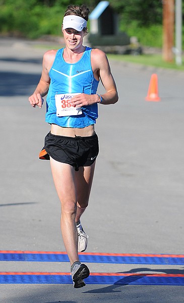 Elliot Welder crosses the finish line first in the men's open 5k with a time of 15:30 on Saturday at the Whitefish Lake Run.