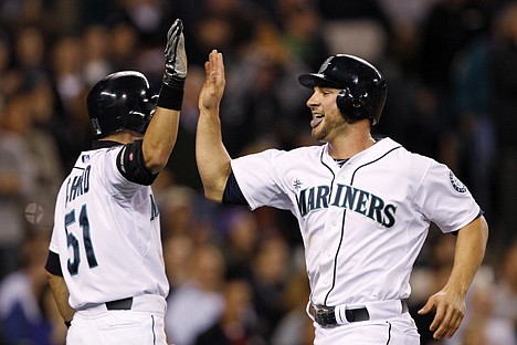 &lt;p&gt;Seattle Mariners' Casper Wells, right, is congratulated by Ichiro Suzuki after scoring against the Oakland Athletics in the eighth inning of a baseball game Tuesday, June 26, 2012, in Seattle. (AP Photo/Elaine Thompson)&lt;/p&gt;