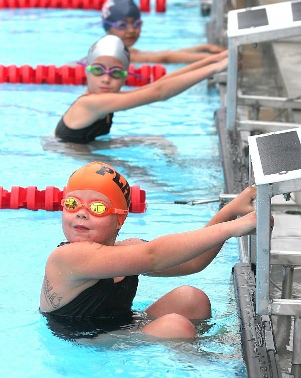 &lt;p&gt;Genevieve Deschamps, 7, gets ready to take off in the backstroke for the 8 &amp; under girls 100 meter medley relay on Sunday at the Plains Invitational Meet.&lt;/p&gt;