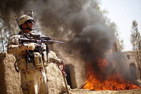 &lt;p&gt;Canadian Army's 1st Battalion 22nd Royal Regiment soldier Sgt. Chris Larochelle, 41, of Quebec, Canada, looks on after soldiers set fire to approximately a thousand pounds of hashish that was discovered in a compound during a joint operation with Canadian and Afghan forces Monday, in the Panjwaii district of Kandahar province, Afghanistan.&lt;/p&gt;