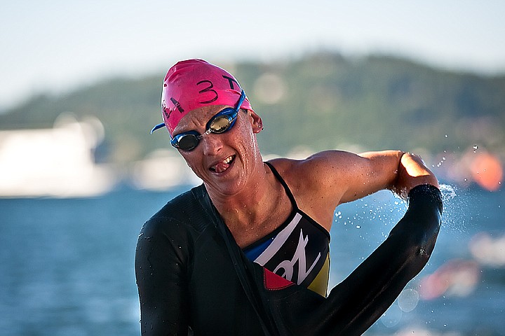 &lt;p&gt;BEN BREWER/Press Professional Kelly Williamson begins to rip her wetsuit off as she crosses the finishing line for the swim section of Sunday's Ironman competition.&lt;/p&gt;