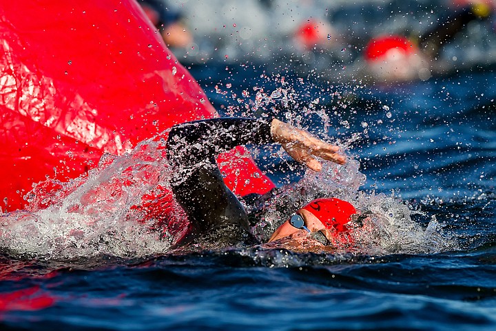 &lt;p&gt;JEROME A. POLLOS/Press Robert Dauchot, from Nolensville, Tenn., splashes his way around a buoy marker during the first lap of the 2.4-mile swim.&lt;/p&gt;