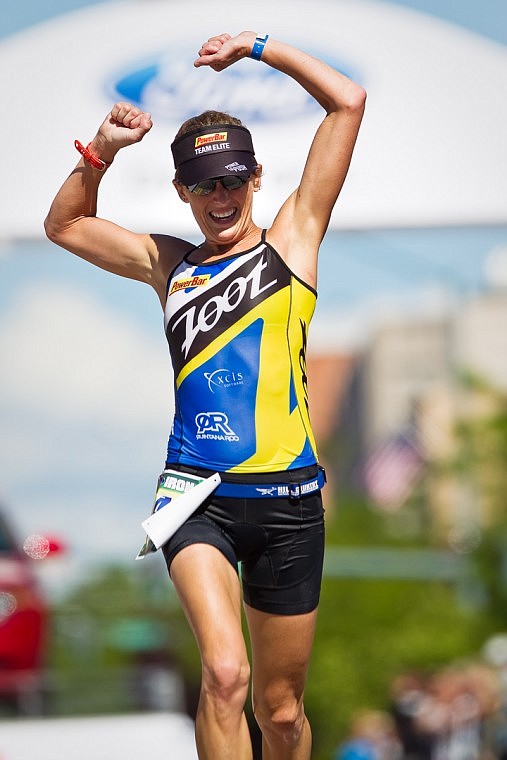 &lt;p&gt;SHAWN GUST/Press Kelly Williamson, of Austin, Texas, raises her hands as she finishes third in the women's division during Sunday's Ironman.&lt;/p&gt;