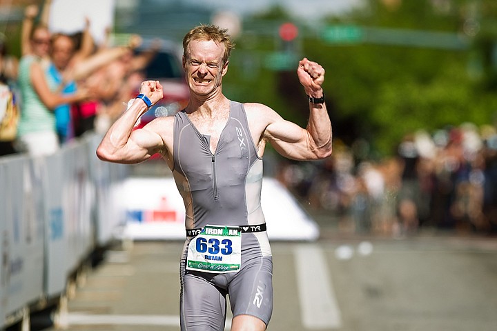 &lt;p&gt;SHAWN GUST/Press Brian Hadley, of Coeur d'Alene, cheers as he leads all other local triathletes to the finish in Sunday's Ironman.&lt;/p&gt;